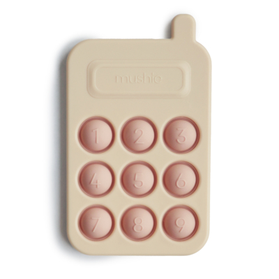 Mushie pukkasztós játék telefon - halvány rózsaszín